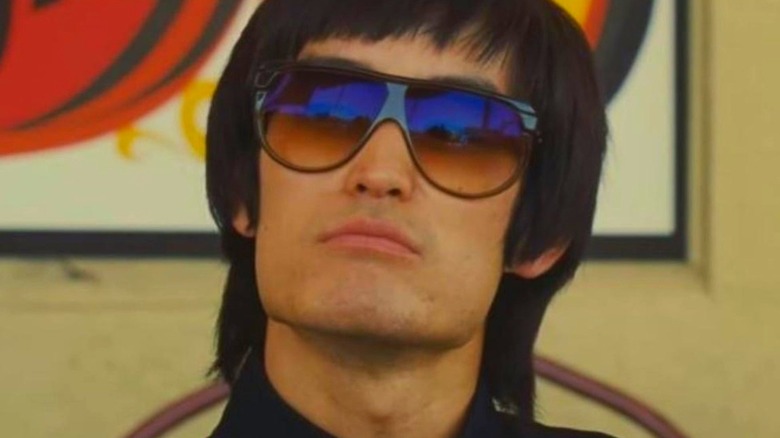 Bruce Lee wearing sunglasses