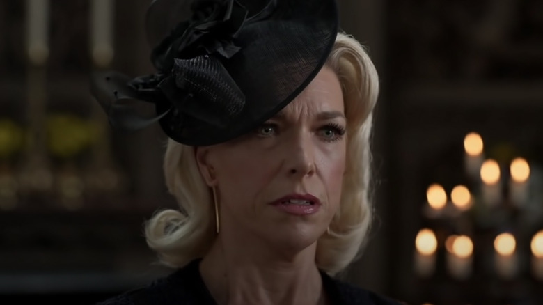 Rebecca looking sad at the funeral