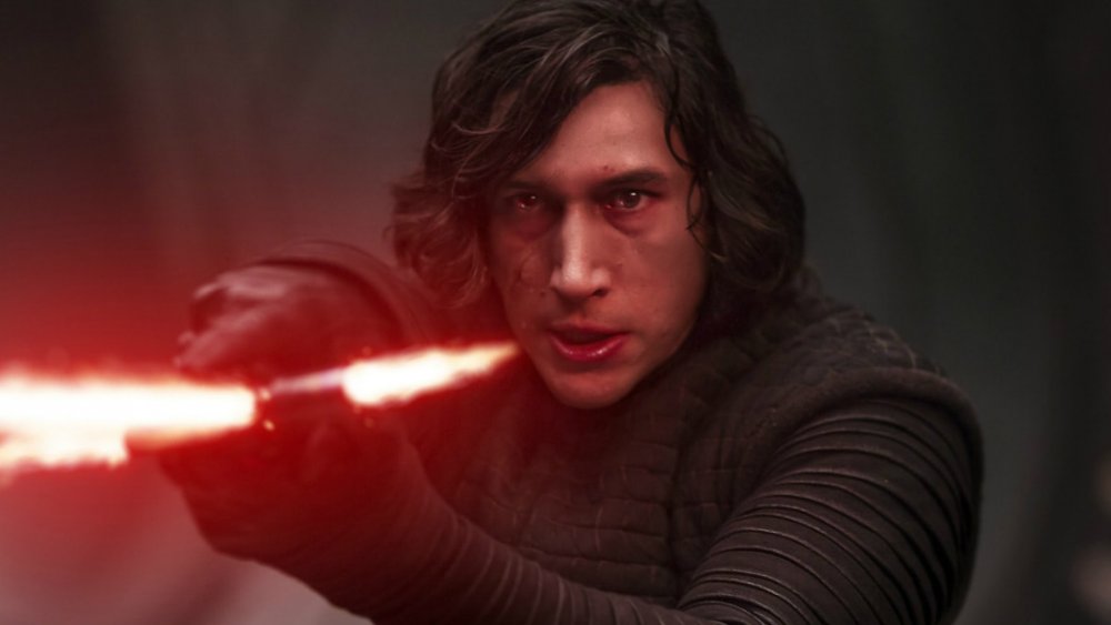 Adam Driver Kylo Ren pointing lightsaber