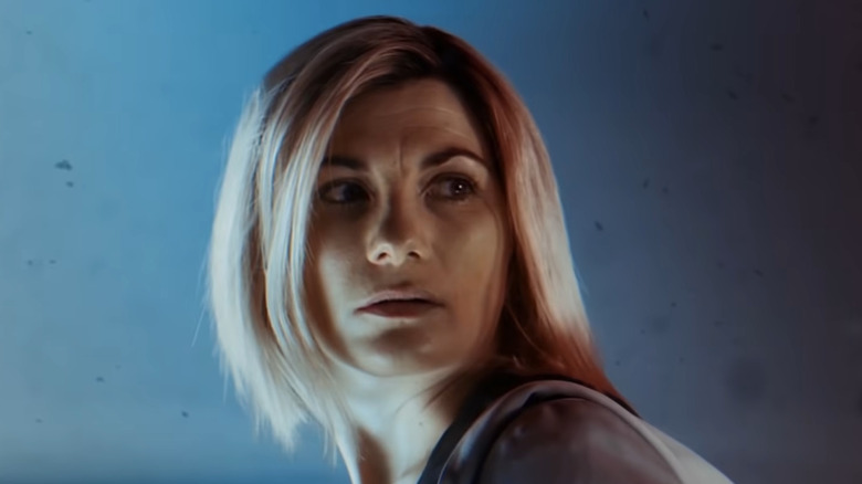 Thirteenth Doctor looking cautiously away