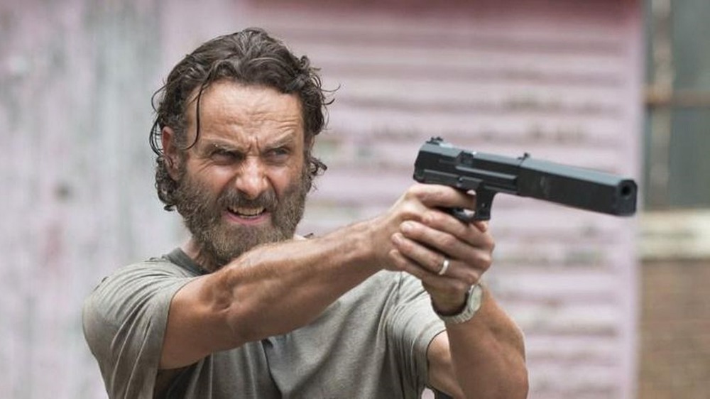 Rick Grimes points a gun in The Walking Dead