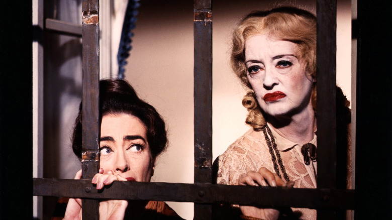 Blanche and Jane behind window bars