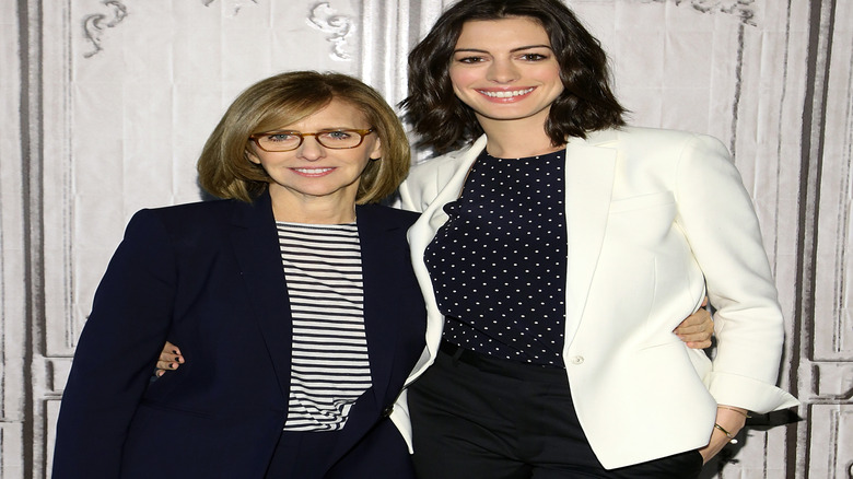 Nancy Meyers and Anne Hathaway smiling