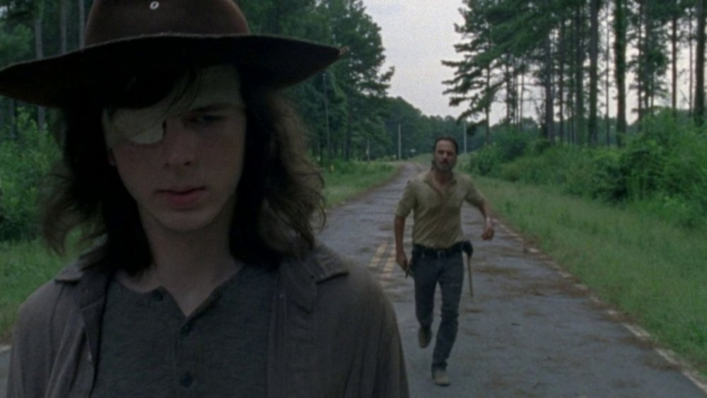Carl (Chandler Riggs) walks away from his father on The Walking Dead