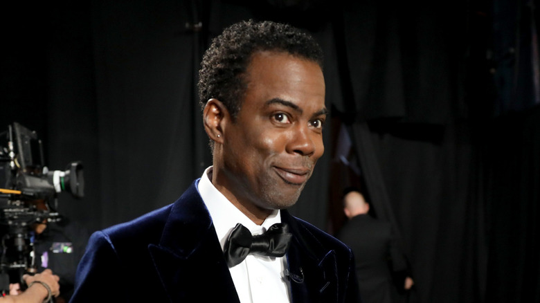 Chris Rock smiling slightly