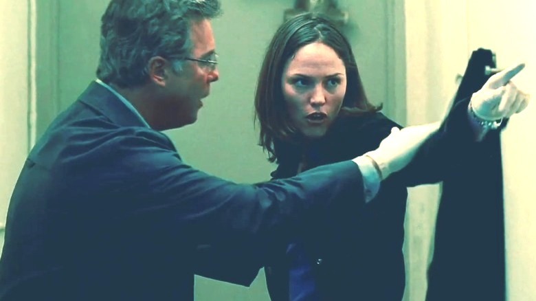 Gil Grissom holding back Sara Sidle 