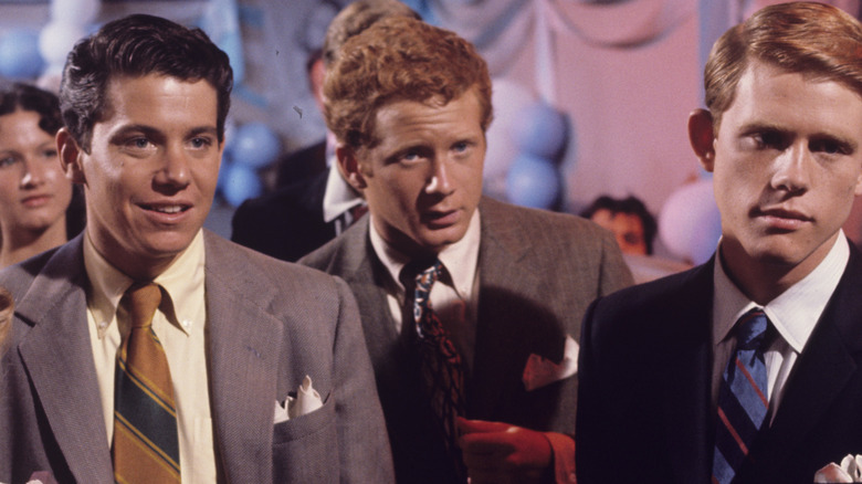 Ralph standing between Richie and Potsie at dance