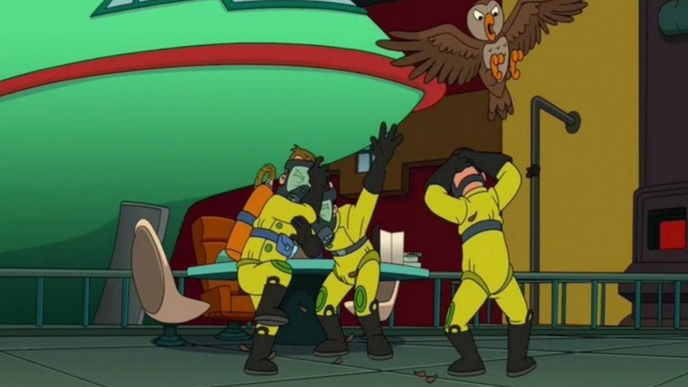 The owl exterminators being attacked by an owl in Futurama