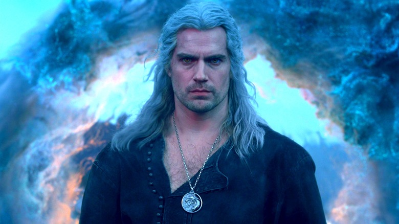 Geralt standing in front of a swirling cloud in "The Witcher"