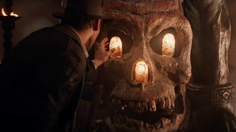 Indiana Jones reaching for the Sankara stones in Indiana Jones and the Temple of Doom