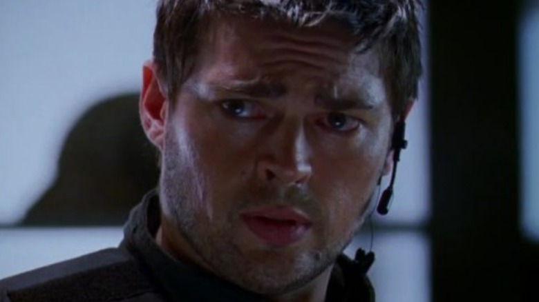 Karl Urban as Reaper looking concerned in Doom