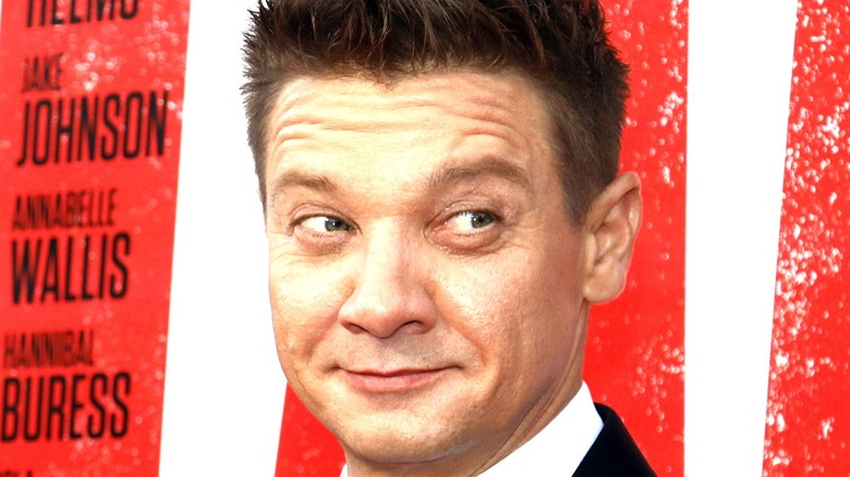 Jeremy Renner smirking