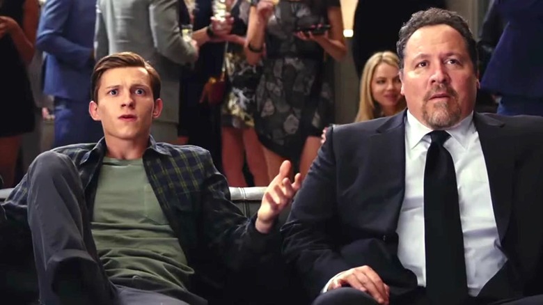 Happy Hogan on couch with Peter Parker