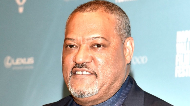 A close up of Laurence Fishburne smiling