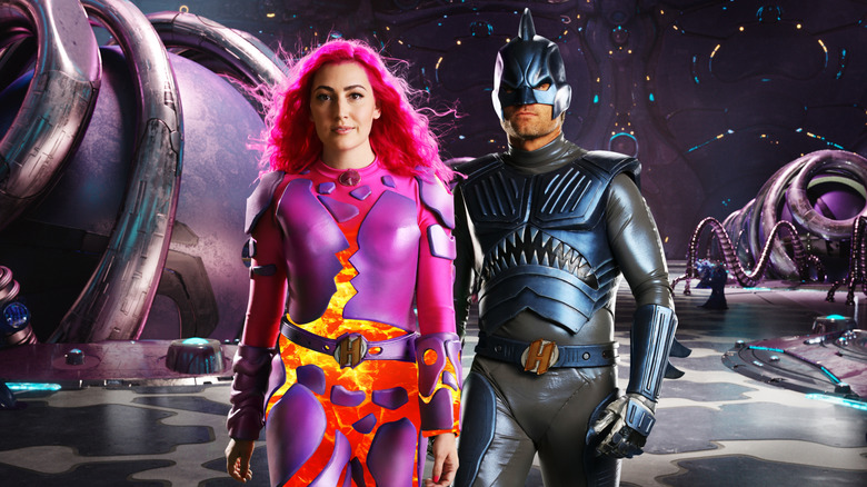 Taylor Dooley and JJ Dashnaw surrounded by superpowered technology