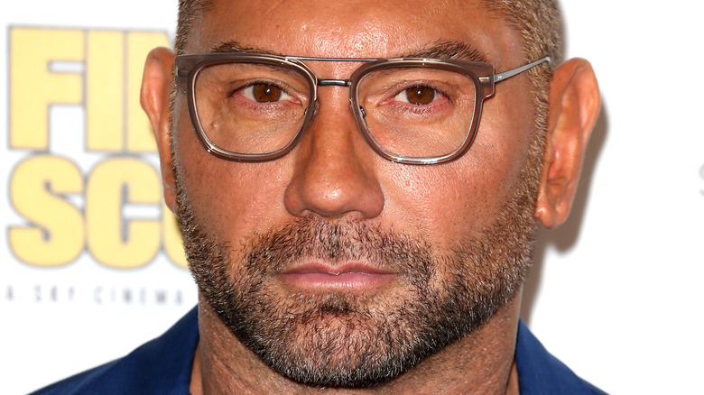 Dave Bautista wearing glasses at event