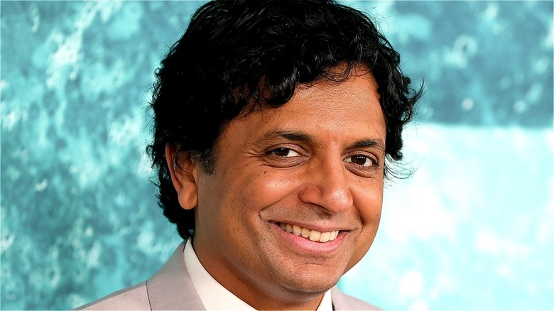 Director M. Night Shyamalan posing for photographers 