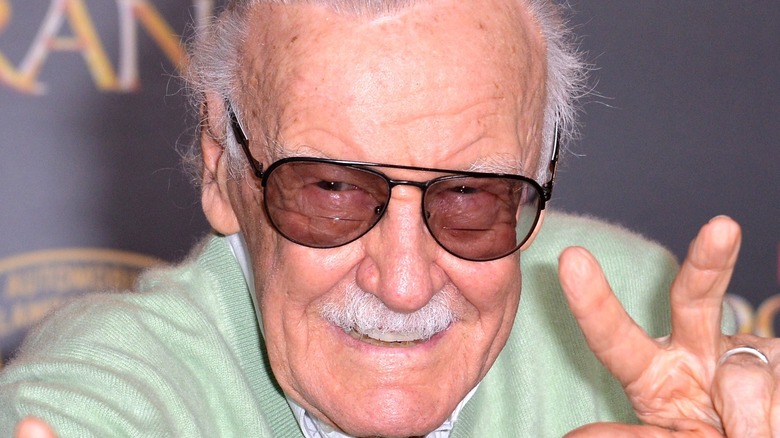 Stan Lee making a peace sign 