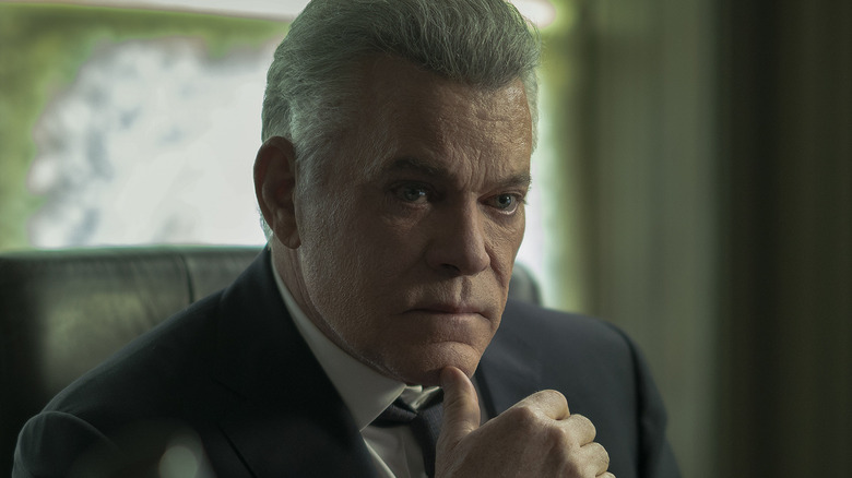 Ray Liotta sitting at his desk