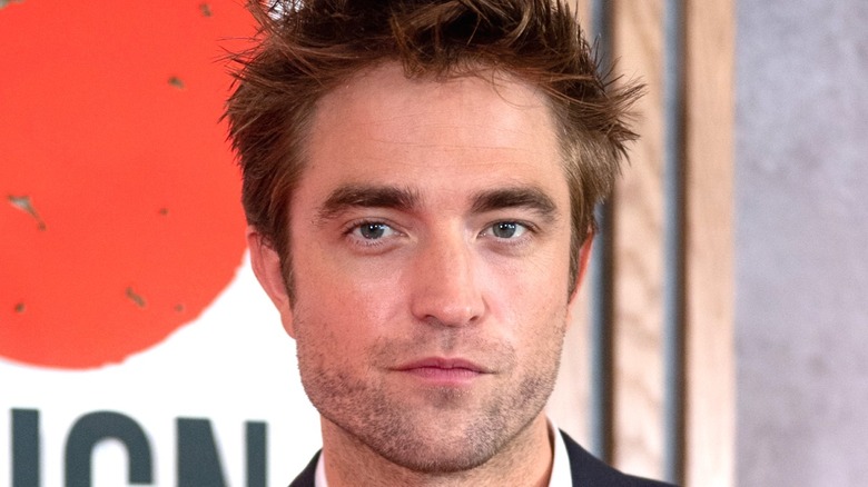 Robert Pattinson looking into camera