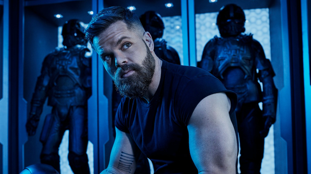 Wes Chatham as Amos Burton on The Expanse