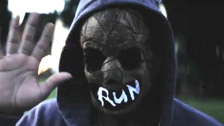 Guy in purge run mask 