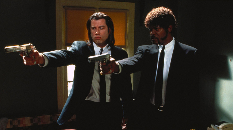 Vincent and Jules point their guns in Pulp Fiction