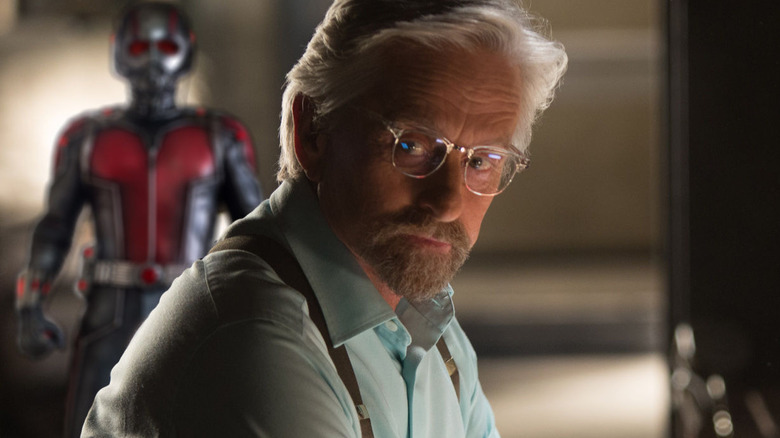 Hank Pym with Ant-Man costume in the background in "Ant-Man" (2015)