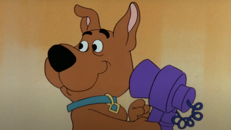 scrappy doo smiling talking on telephone