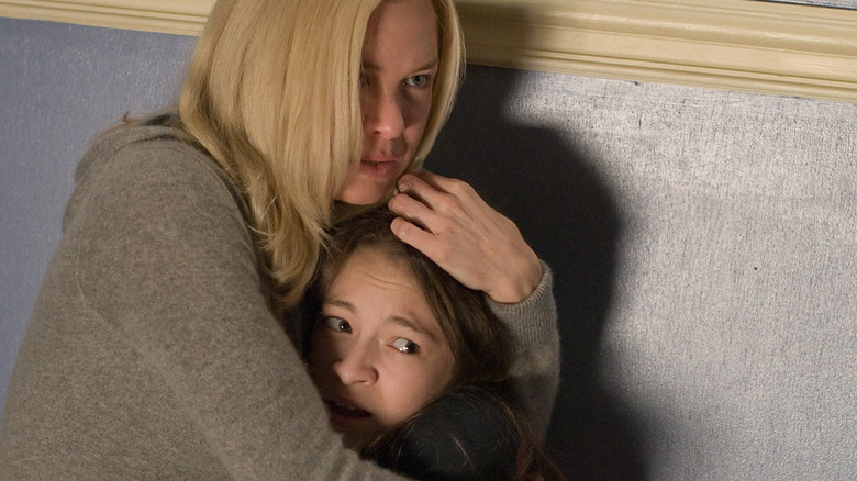 Renee Zellweger protecting a child