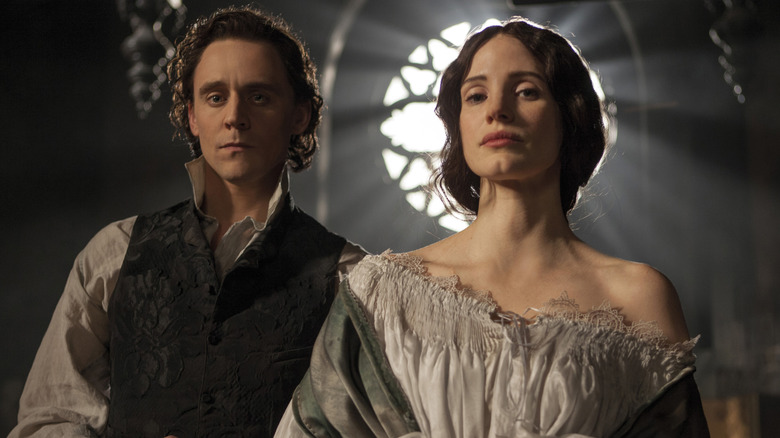Tom Hiddleston and Jessica Chastain staring