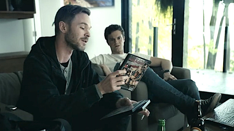Lamplighter and Hughie looking at DVDs