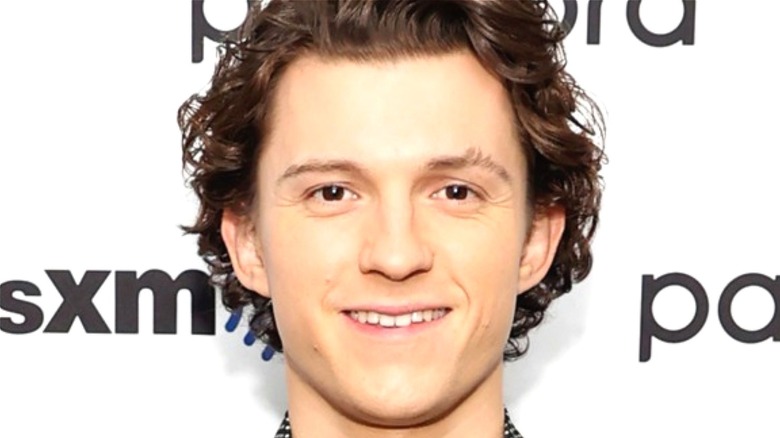Tom Holland smiling curly hair