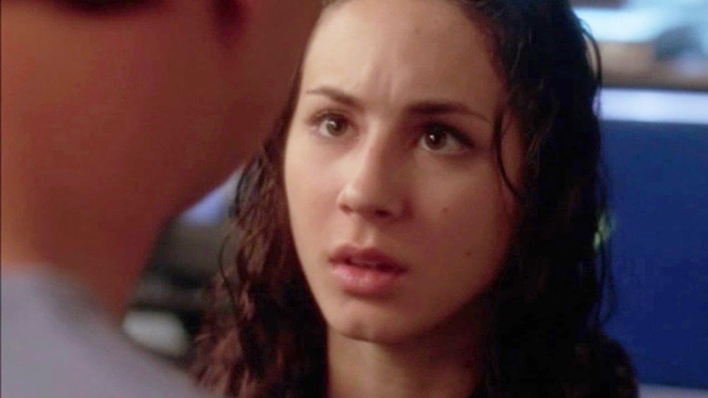 Troian Bellisario as Sarah McGee with wet hair and a scared expression in NCIS