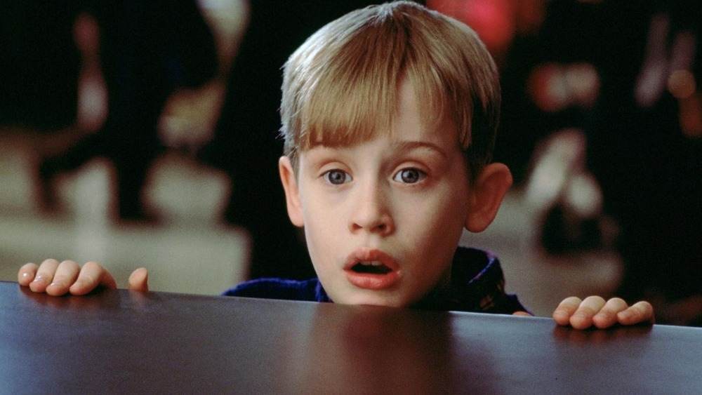 Macaulay Culkin peeking over table