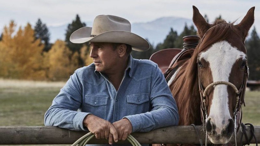 Yellowstone John Dutton with horse on the ranch