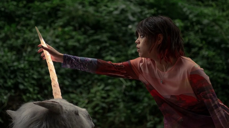Ridley touching a unicorn horn in Death of a Unicorn (2025)