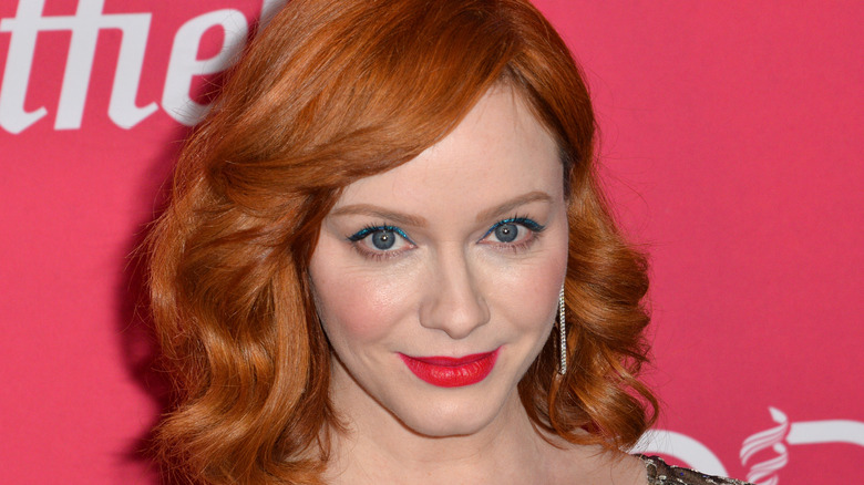 Christina Hendricks smiling with red lipstick