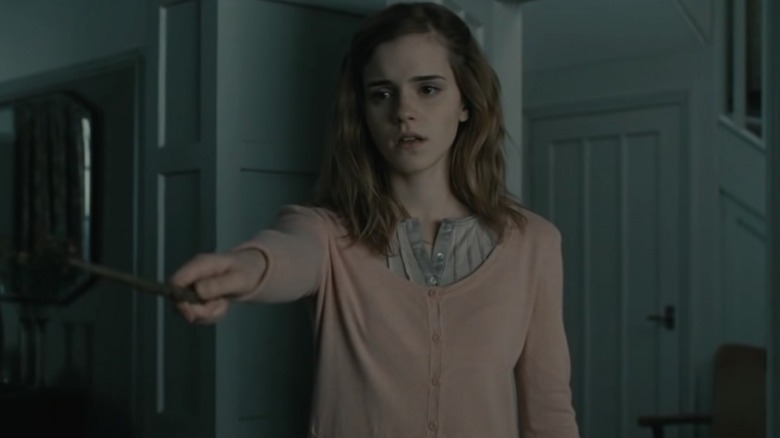 Hermione holding out her wand