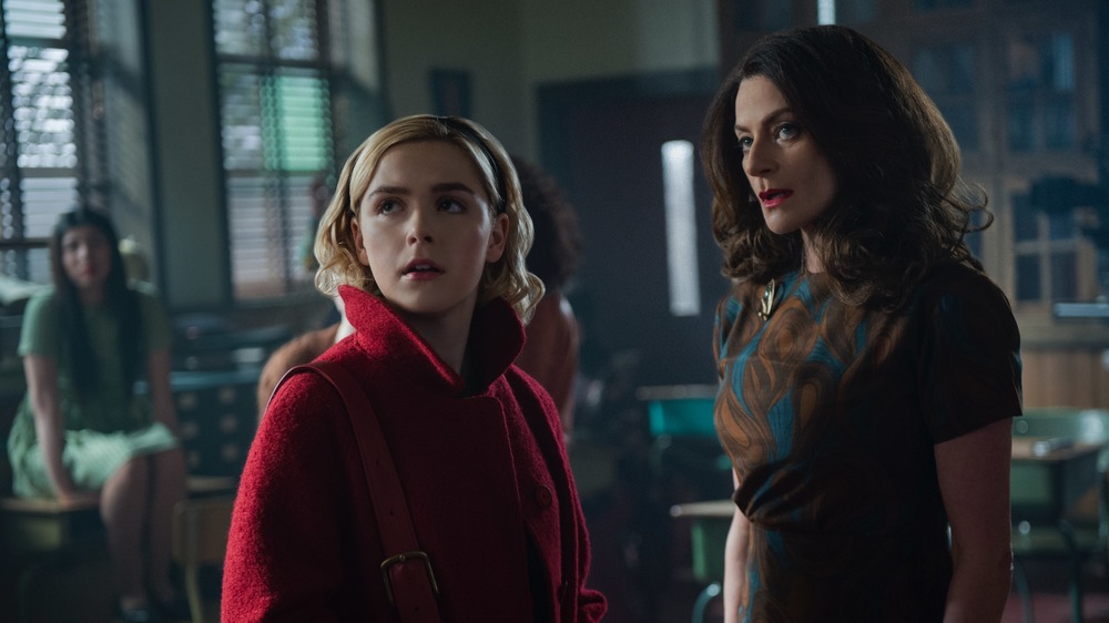 Sabrina Spellman and Madam Satan talking in classroom