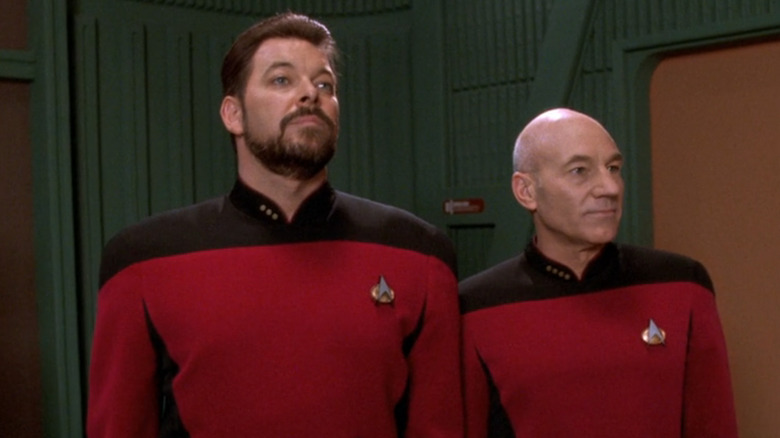 Riker and Picard looking on