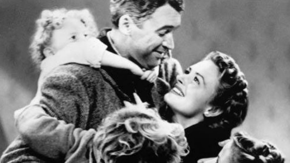 George Bailey (Jimmy Stewart) lifts up Zuzu in It's A Wonderful Life
