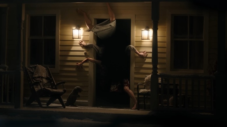 Limbs coming out of a doorway in the Resident Evil trailer