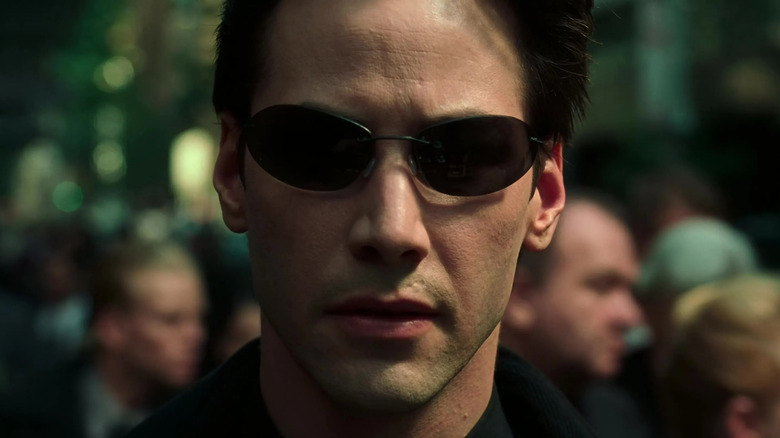 Neo walking streets black glasses