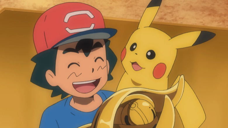 Ash with Pikachu and trophy