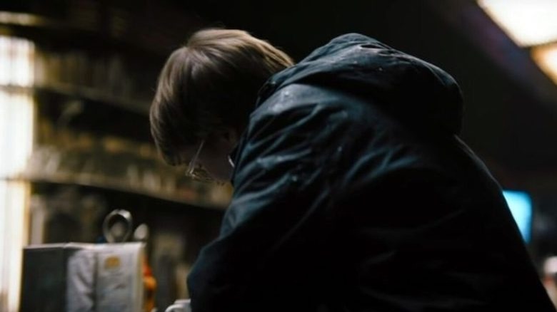 The Riddler sat alone in coffee shop