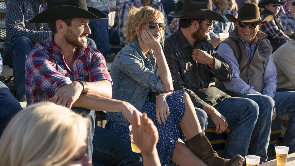 The cast of Yellowstone with some strategically placed Coors cups