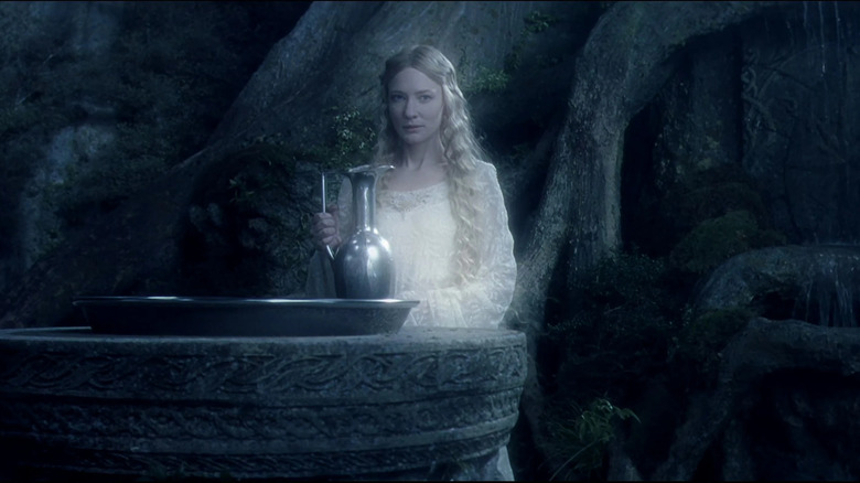 Galadriel stands next to her mirror