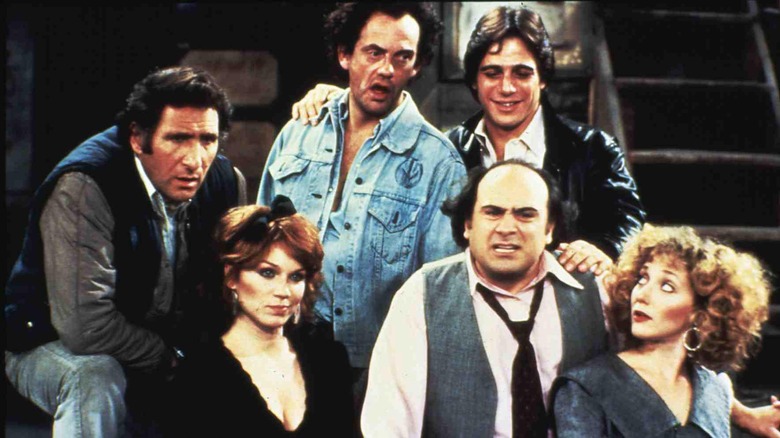 The cast of Taxi acting goofy