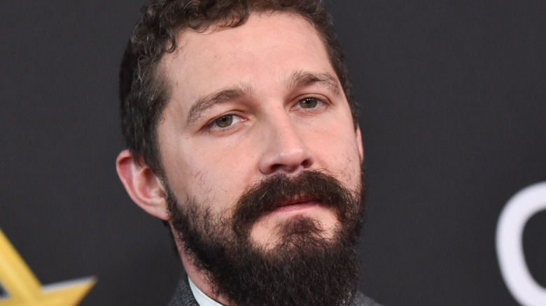 Shia LaBeouf red carpet stoic serious